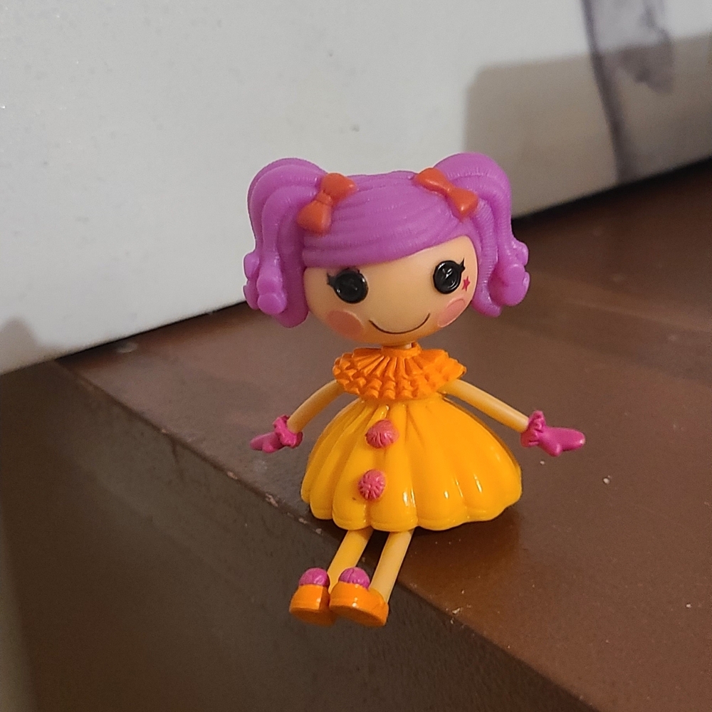 Colorful Doll with Purple Hair and Orange Dress